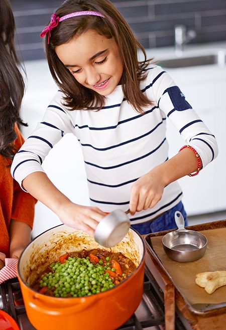 girl making stew