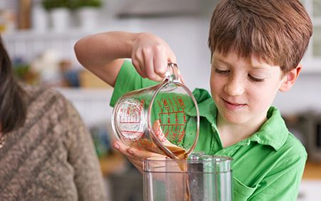 boy pouring liquid